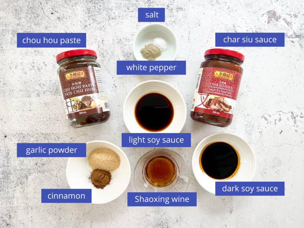 Char siu chicken marinade ingredients which are char siu sauce, chou hou paste, soy sauce (light & dark), white pepper, Shaoxing wine, garlic powder, cinnamon and salt.