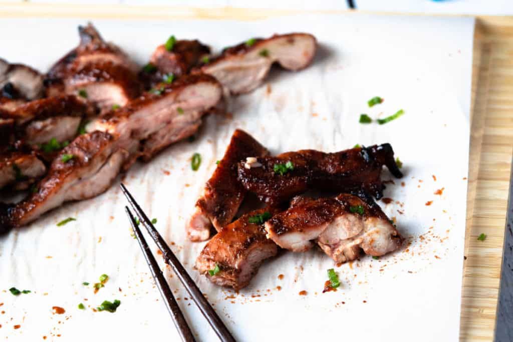 Close up of tender char siu chicken slices.