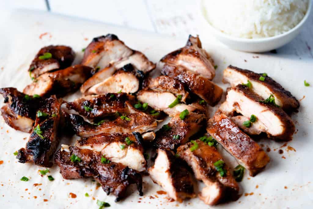 Close up view of sliced char siu chicken.