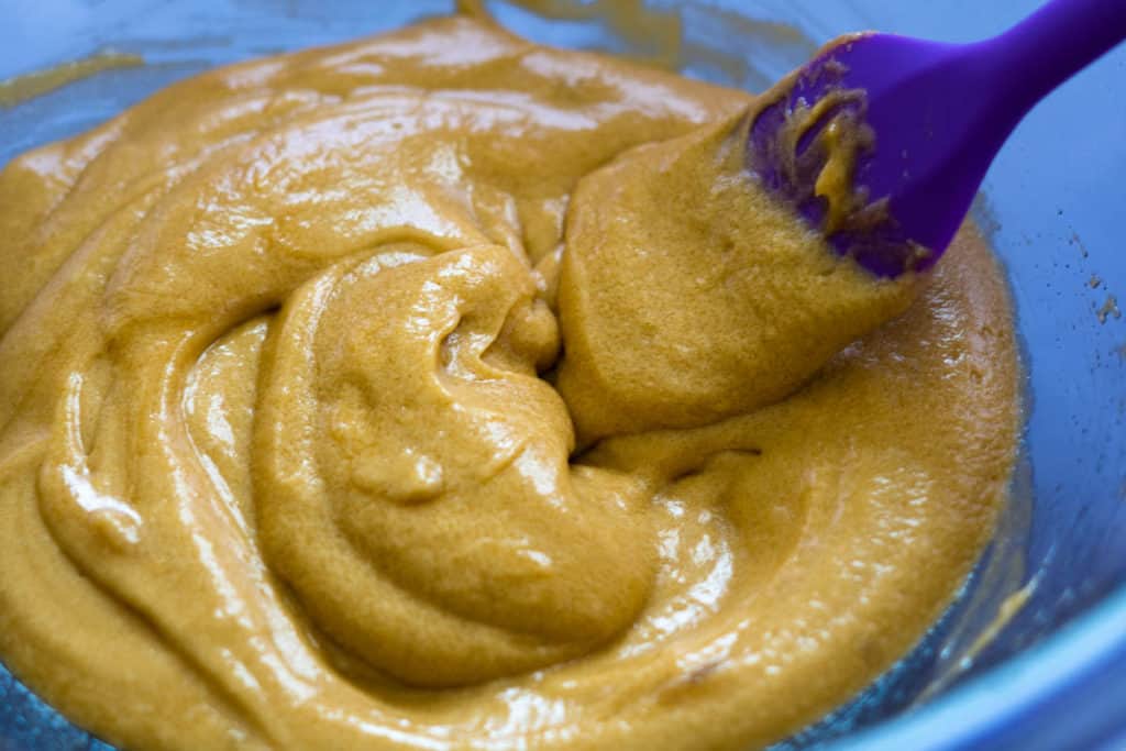 Glossy wet ingredients for matcha cookies.