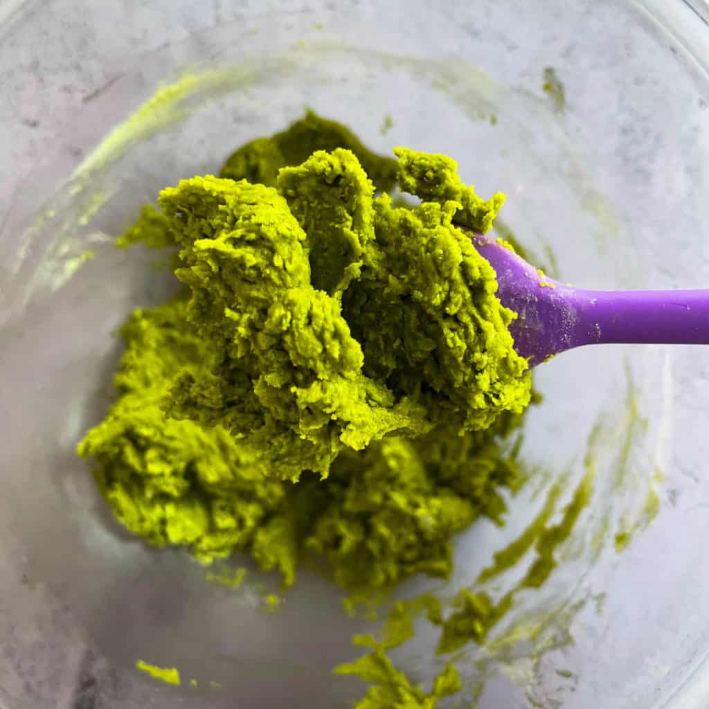 Close up of matcha cookie batter on a spatula.