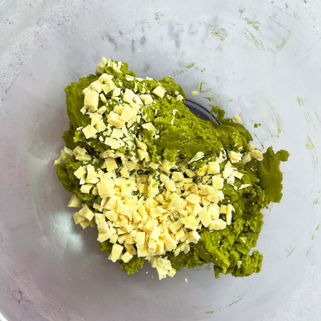 Combine white chocolate in matcha cookie batter.