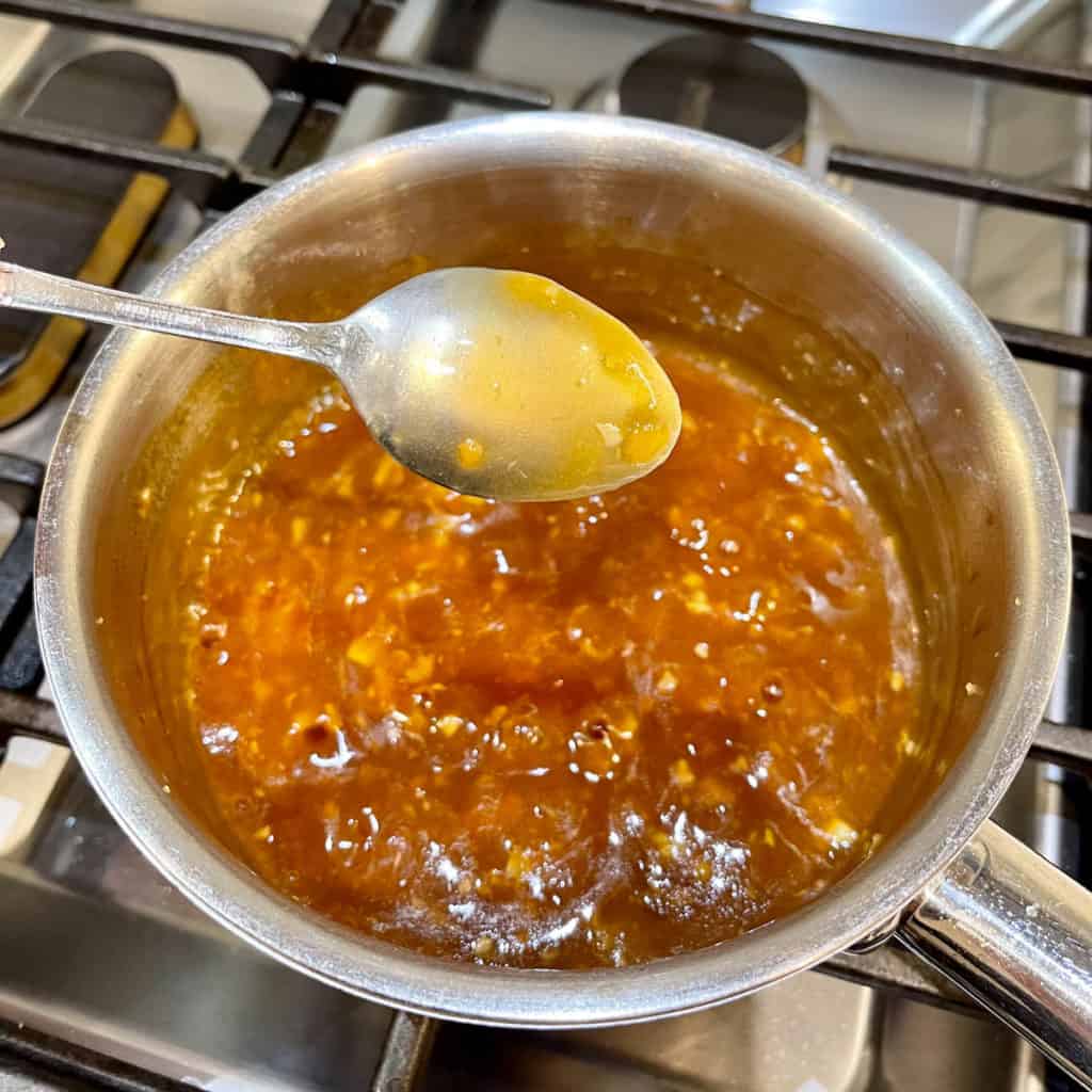 Simmer on low heat till thickened and coats a spoon.