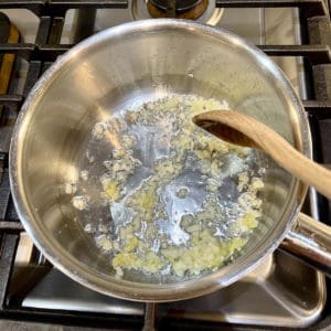 Sautee fresh ginger and garlic in pot.
