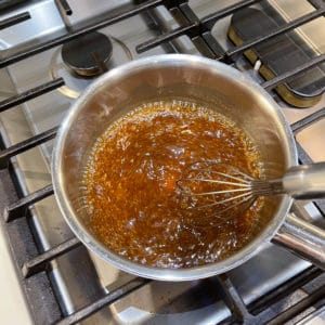 Chinese brown sauce simmering in pot.