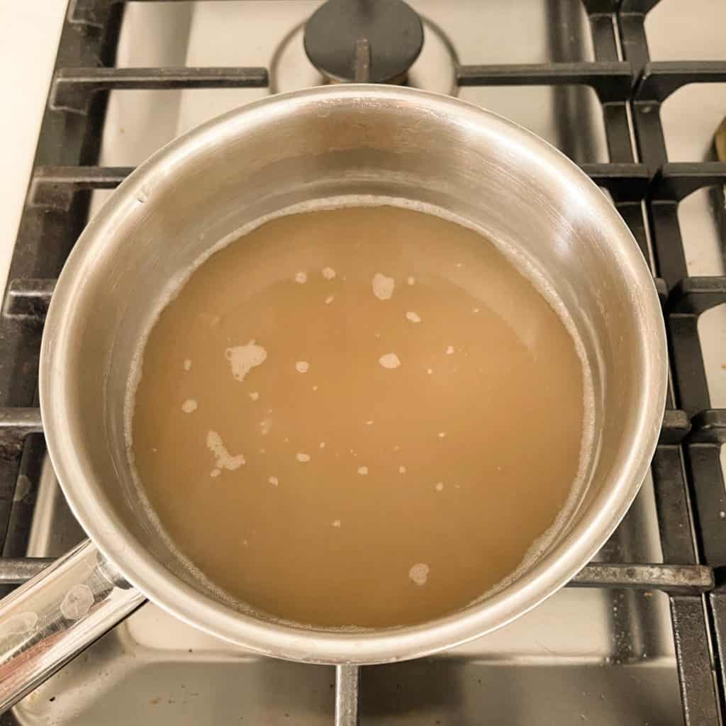 Reheat chicken foot soup in a pot for even warming.