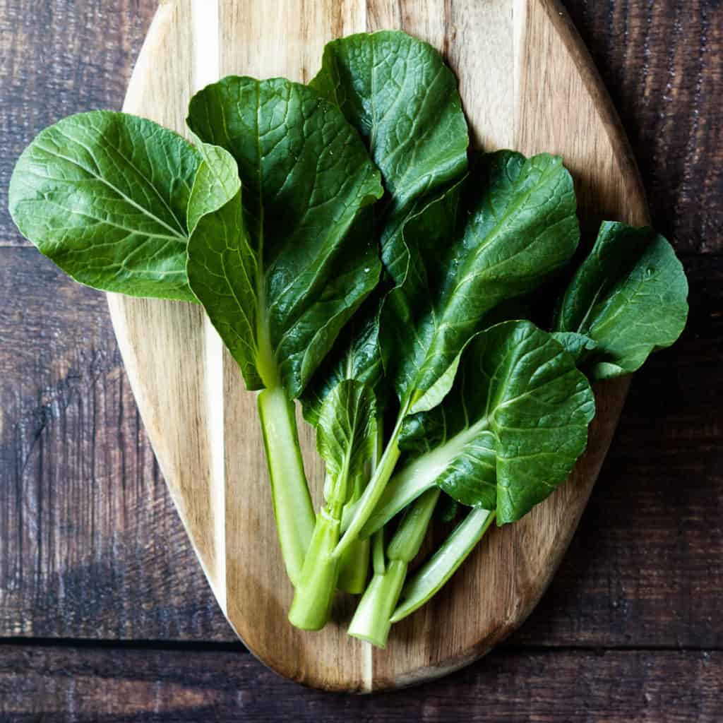 Raw yu choy close up.