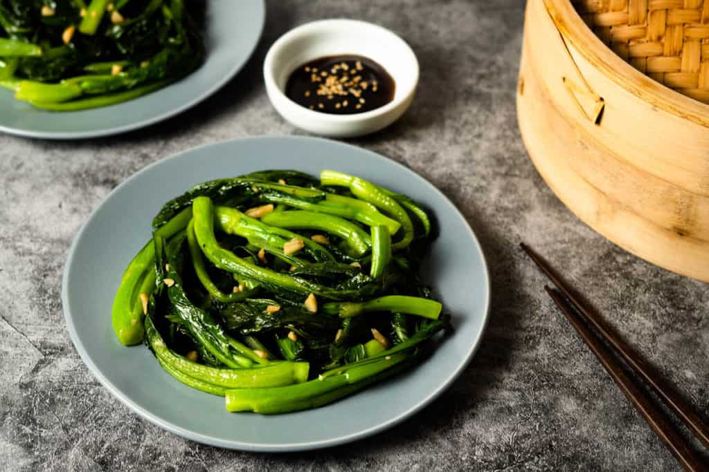 Yu choy on a dim sum table.