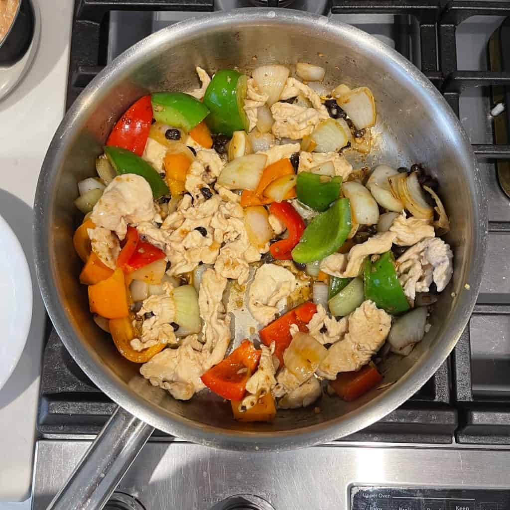 Add chicken slices to stir fry.