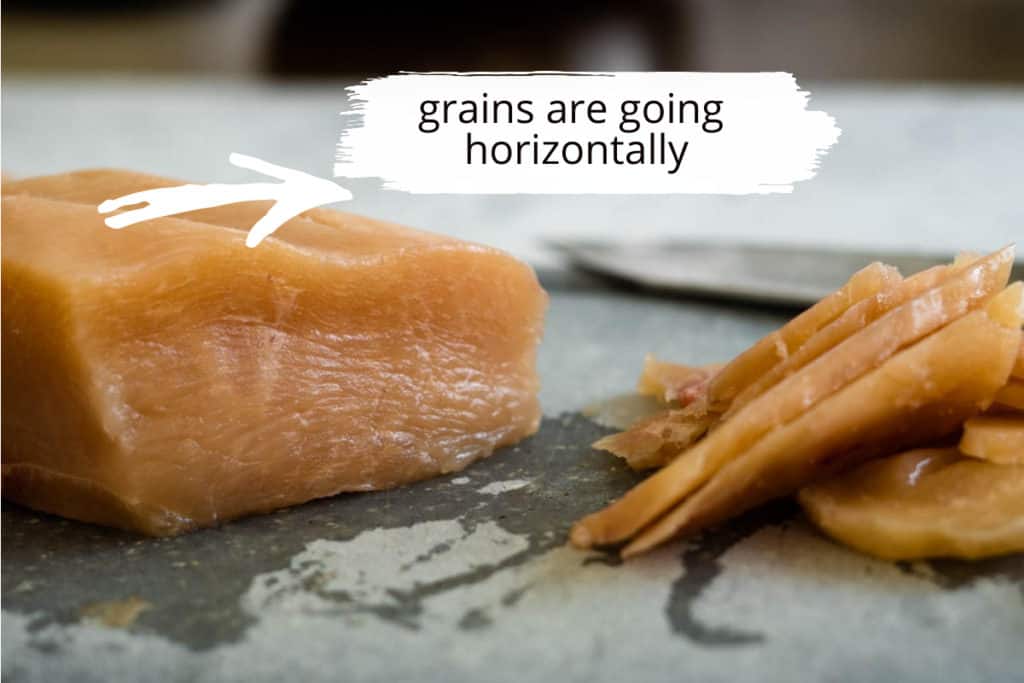 Piece of chicken breast with the muscular grains.