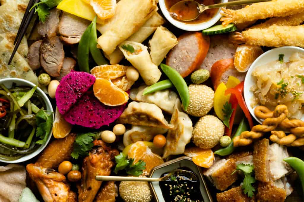 Fill out the rest of your Asian charcuterie board with snacks, fresh fruit and vegetables.