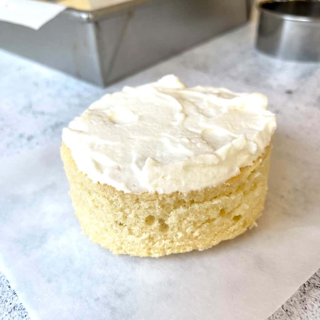 Cake tier with half an inch of frosting.