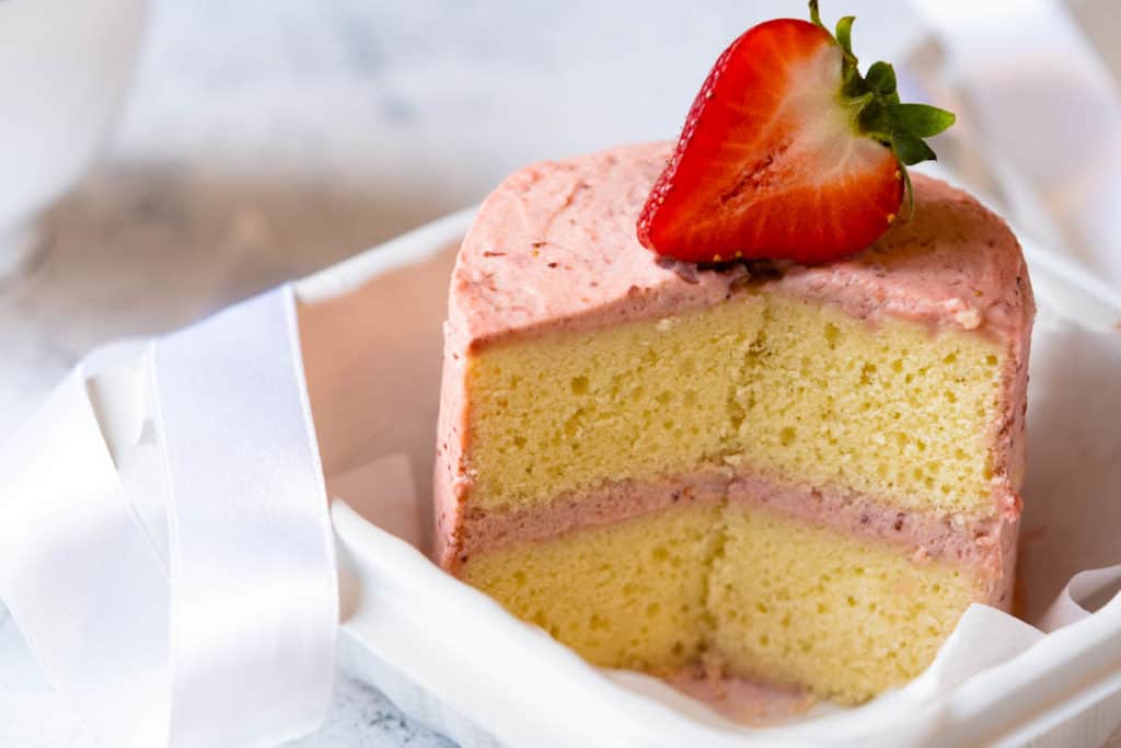 Sliced strawberry lunch box cake.