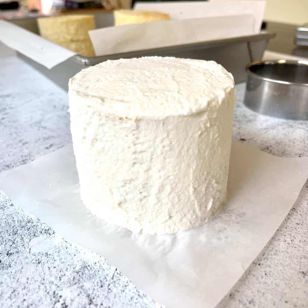 Lunch box cake with finished smooth frosting.