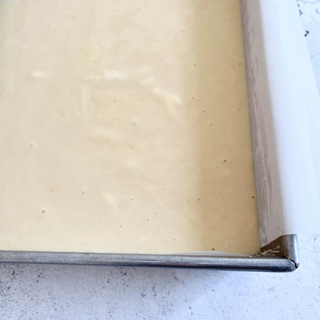 Cake batter in pan.  Small air bubbles ok on the surface.