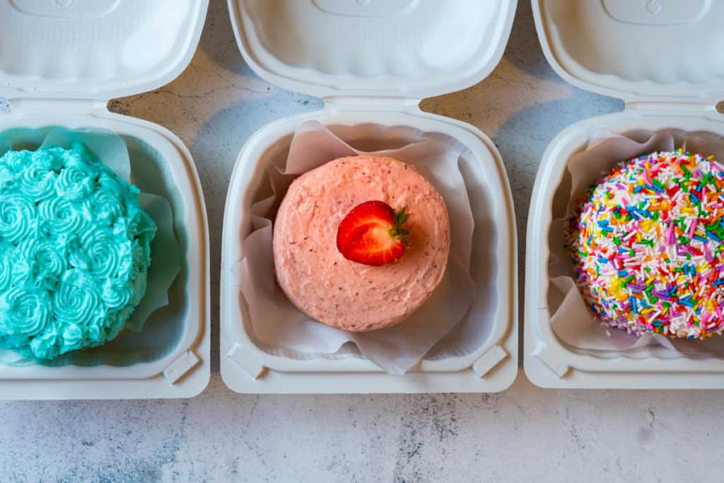Lunch box cakes lined up all nice.