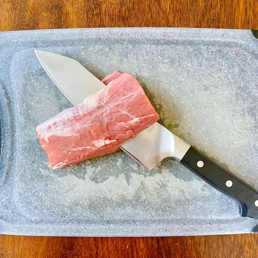 Pork tenderloin cut lengthwise.
