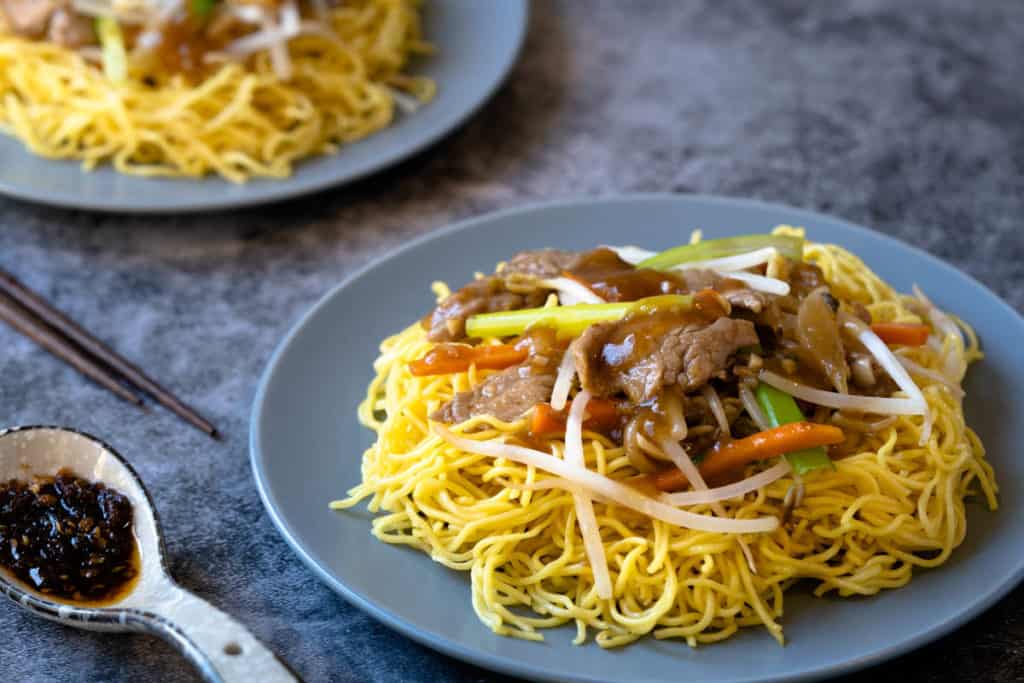Pork chow mein served with hot satay dipping sauce.