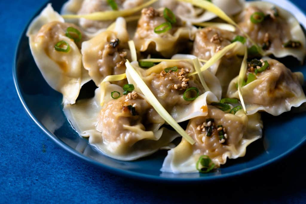 Plate of wontons close up.