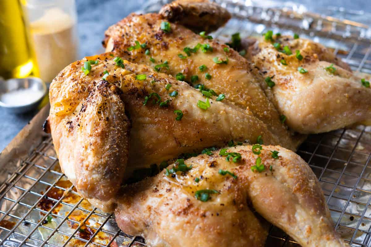Whole roasted chicken on a wire rack.