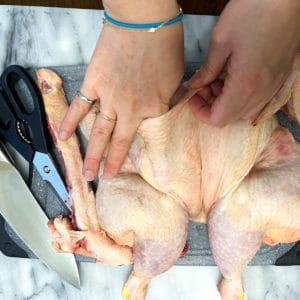 Separating the skin from the meat using fingers.