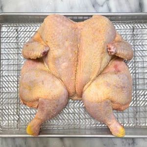 Flattened butterflied chicken.