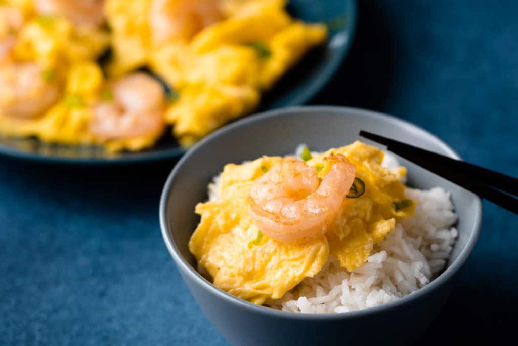 Shrimp omelet on a bowl of rice.