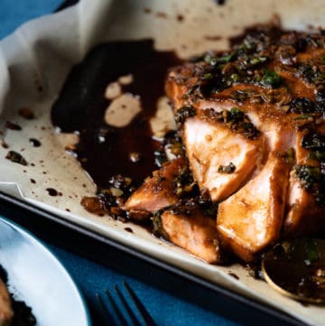 Soy maple salmon whole fillet on a baking pan.