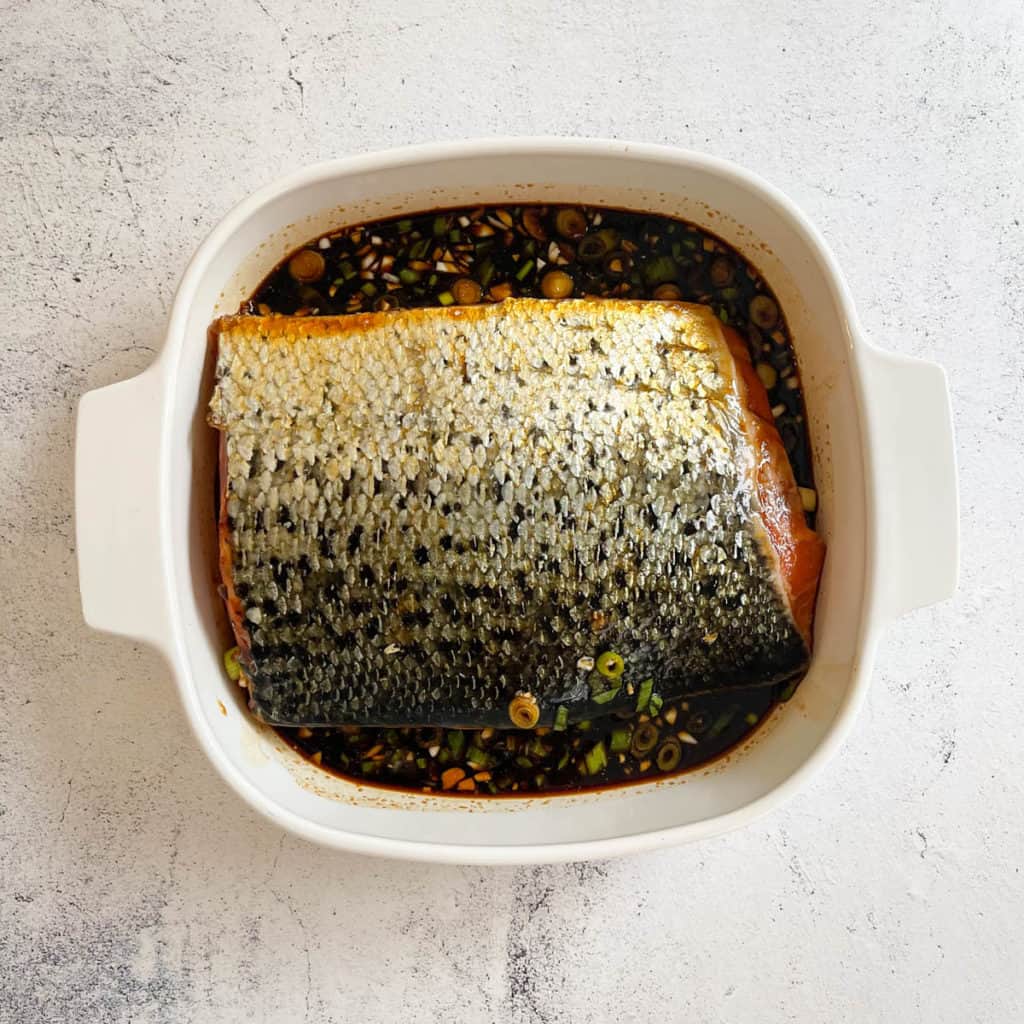 Marinated salmon fillet with skin side up for better flavors.