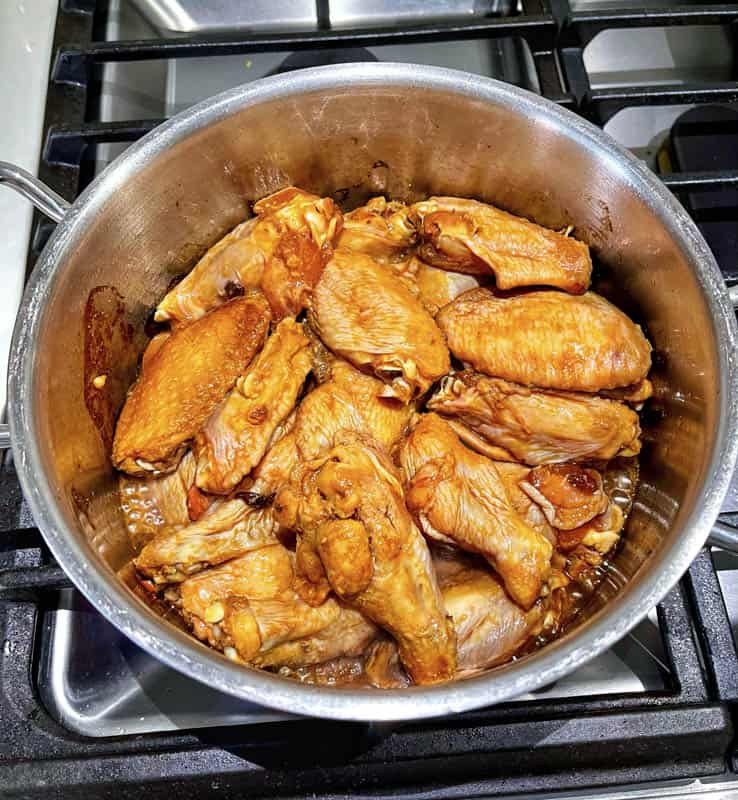 chicken with honey garlic soy marinade in a pot