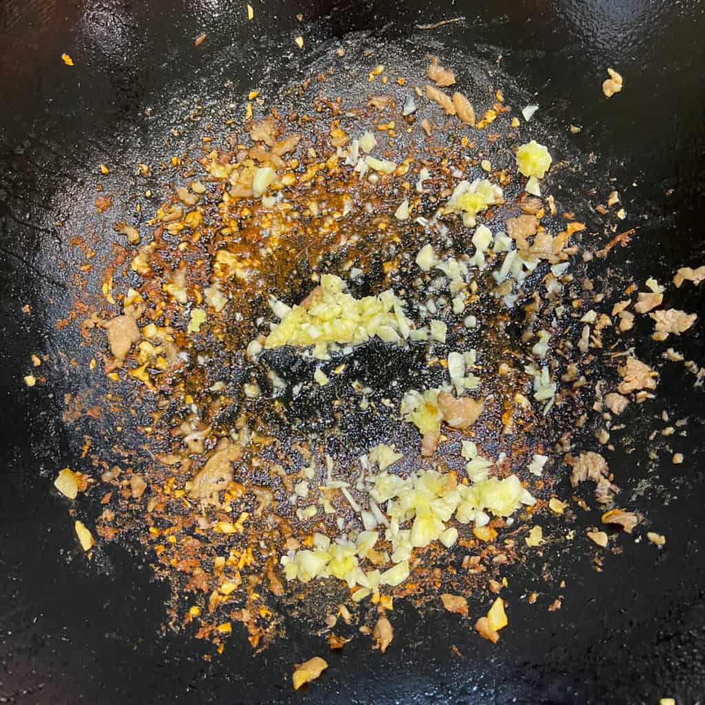 Browned bits at the bottom of wok.