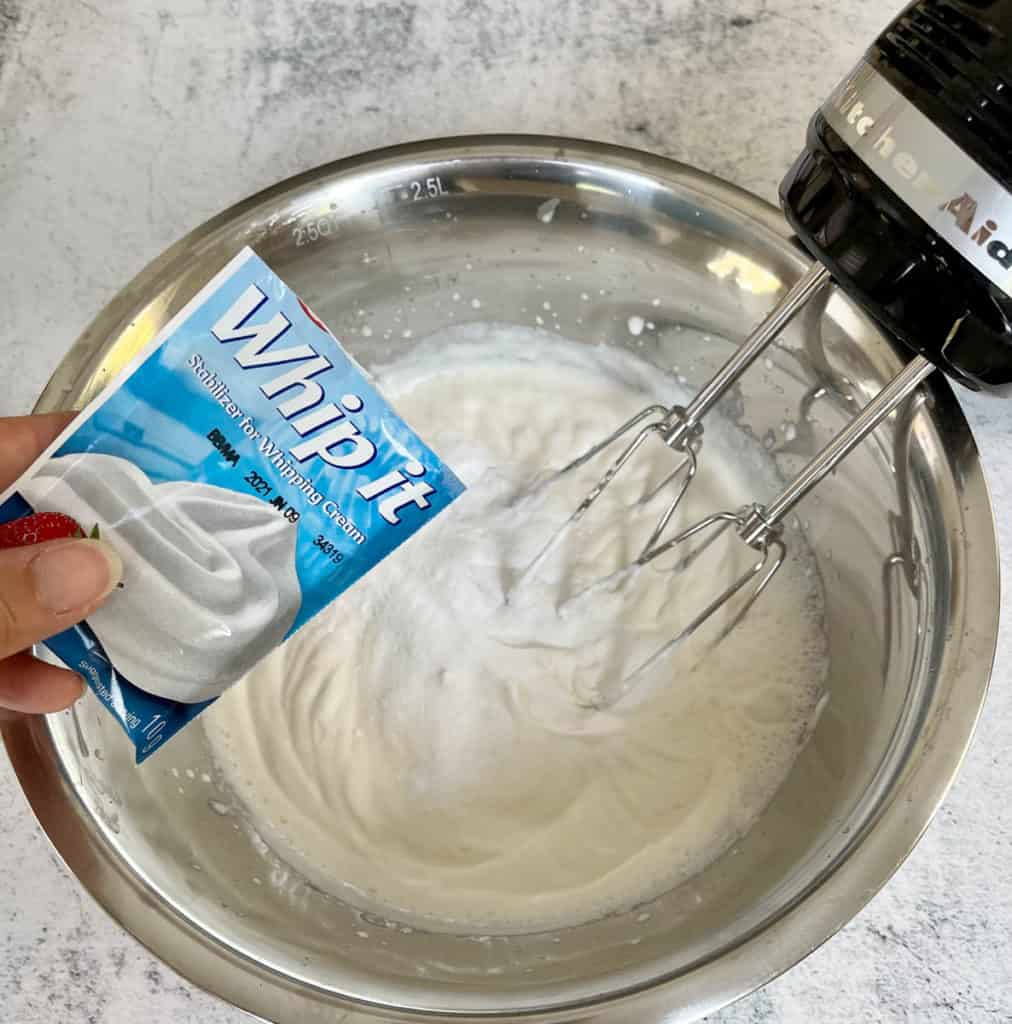 Adding stabilizer to whipped cream.