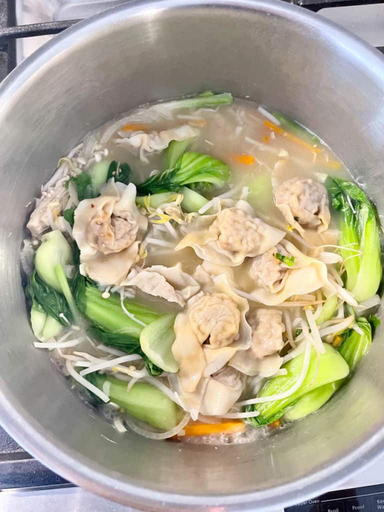 Vegetable wonton soup ready to be served.