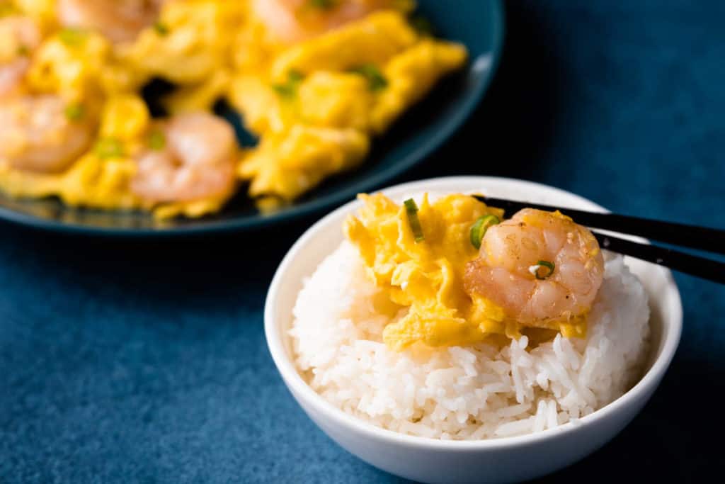 Shrimp omelet on a bowl of rice.