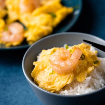 Shrimp omlette on a bowl of rice.