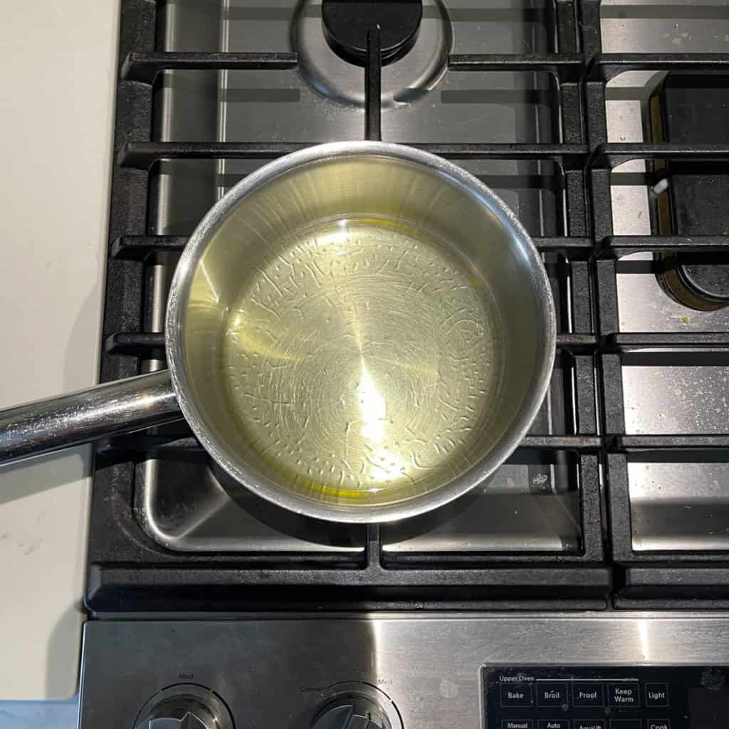 Shimmering oil in a pot.