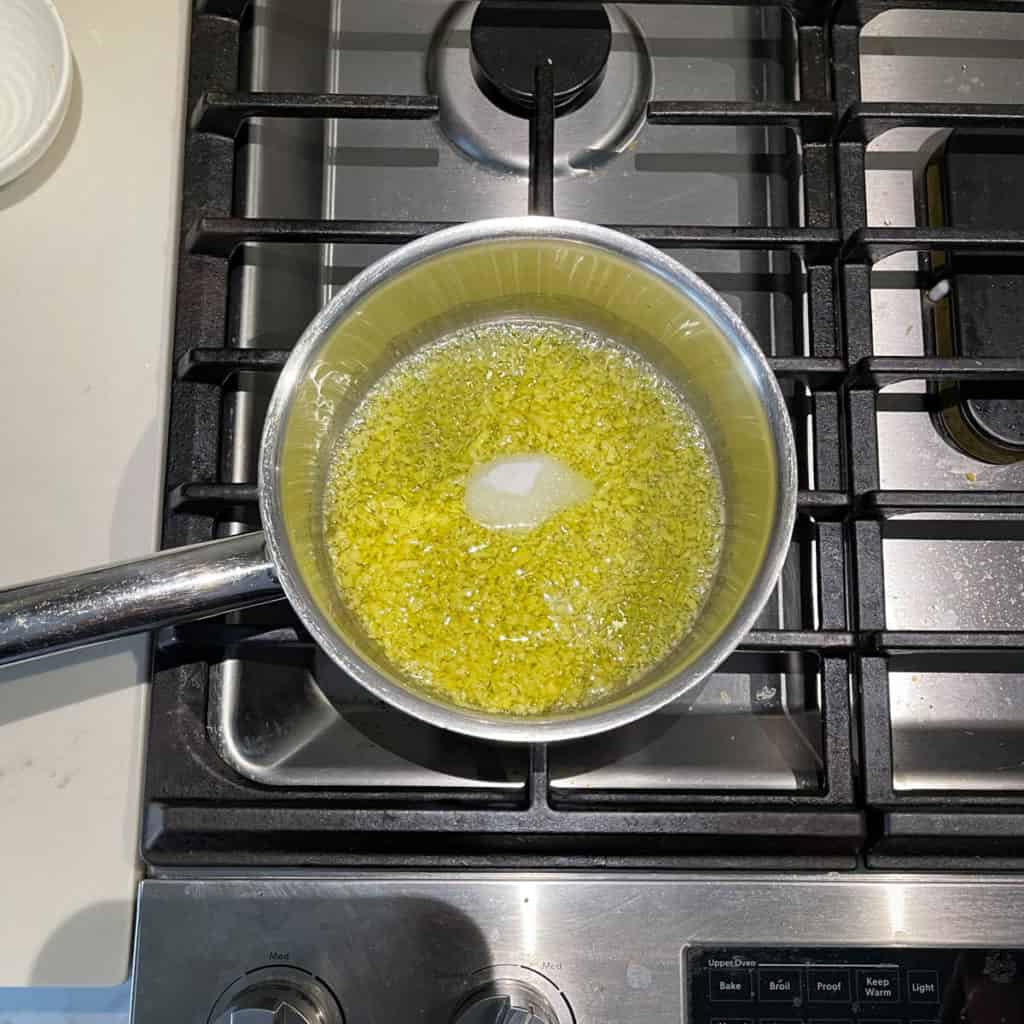 Salt added to a pot with sautéed ginger.