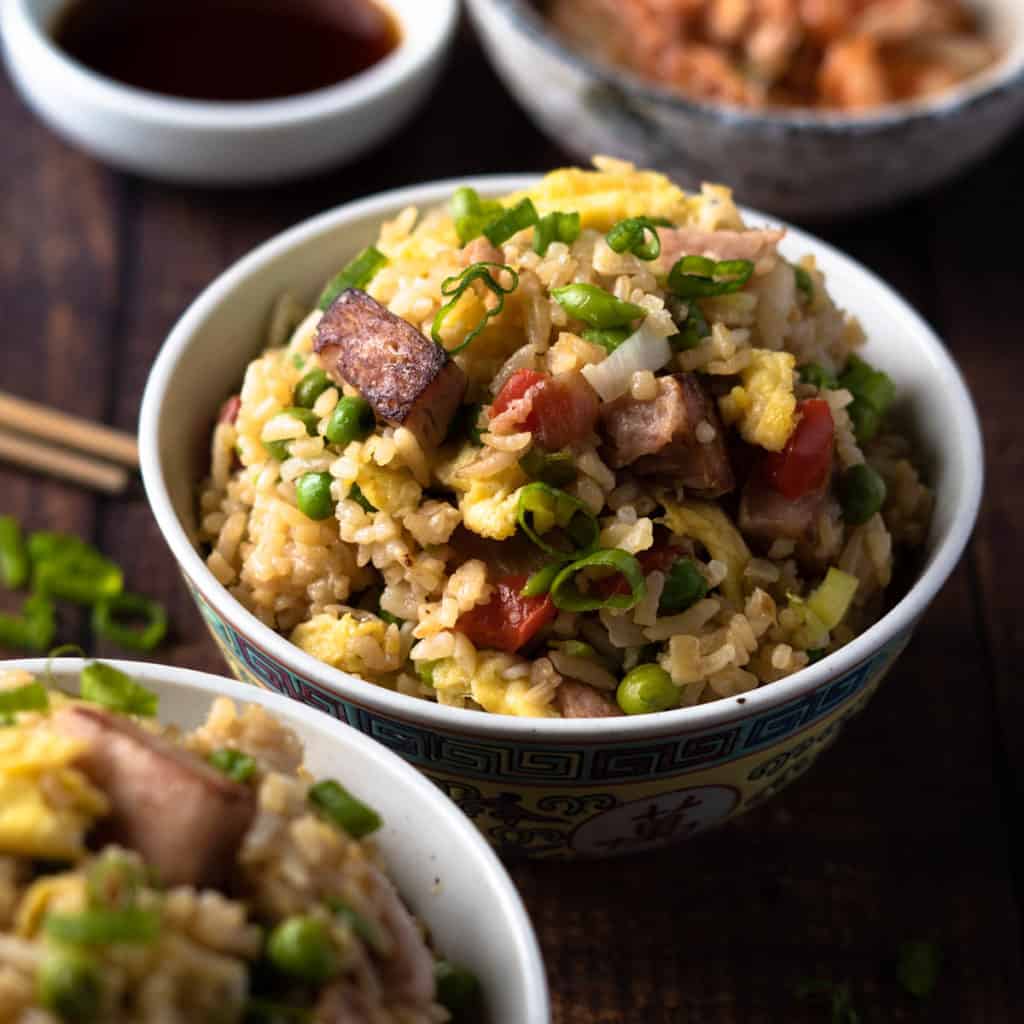 Nicely seared spam in spam fried rice served in a traditional Chinese rice bowl.
