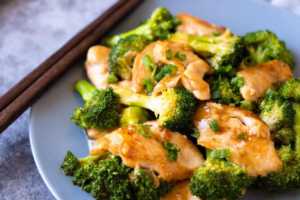 Plate of broccoli and chicken stir fry.