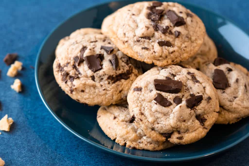 Plate of soft baked chocolate chip cookies without baking soda or powder.