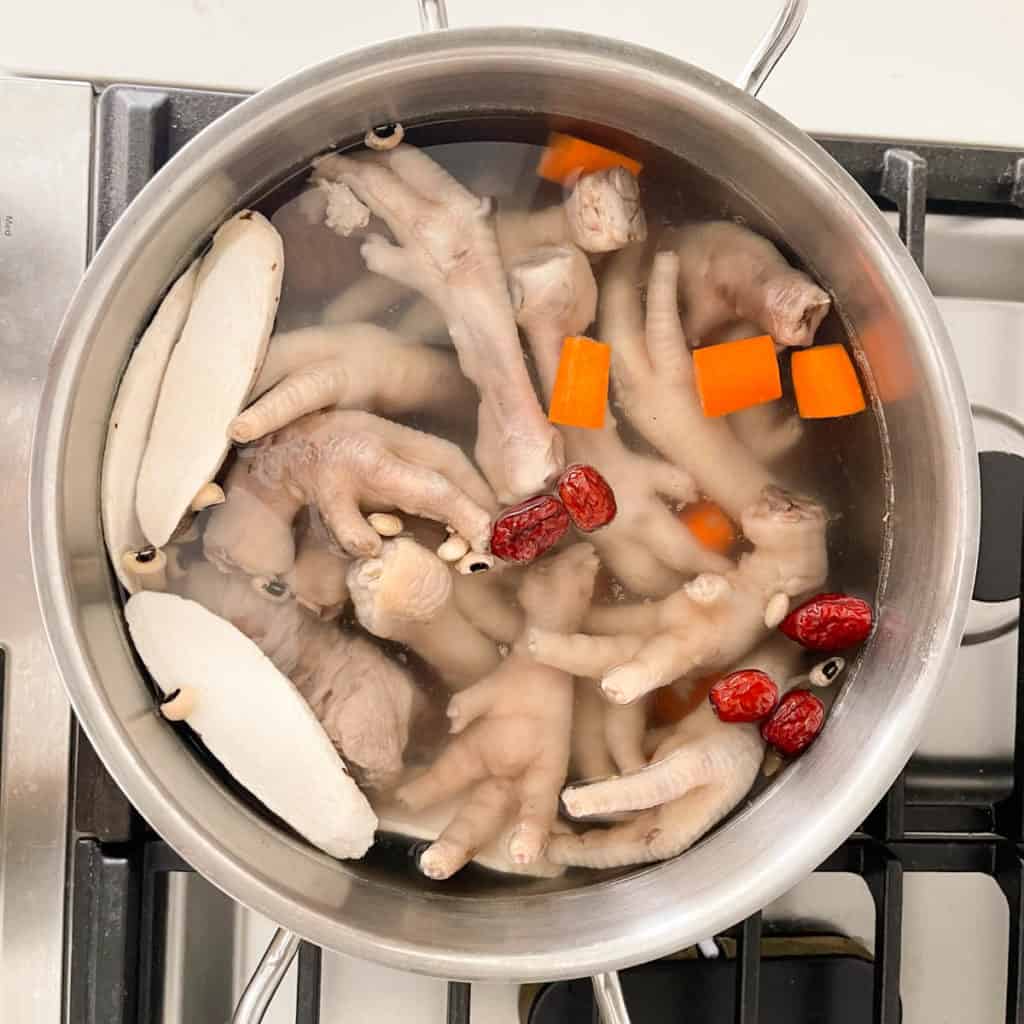 Place all chicken foot soup ingredients in your soup pot.  Bring to a boil.